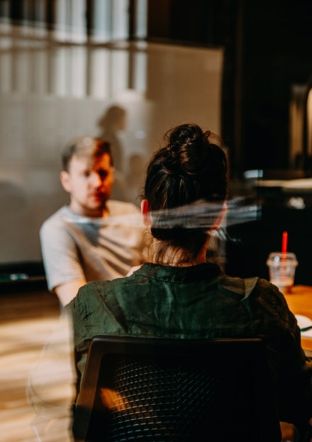 two people in a conference room