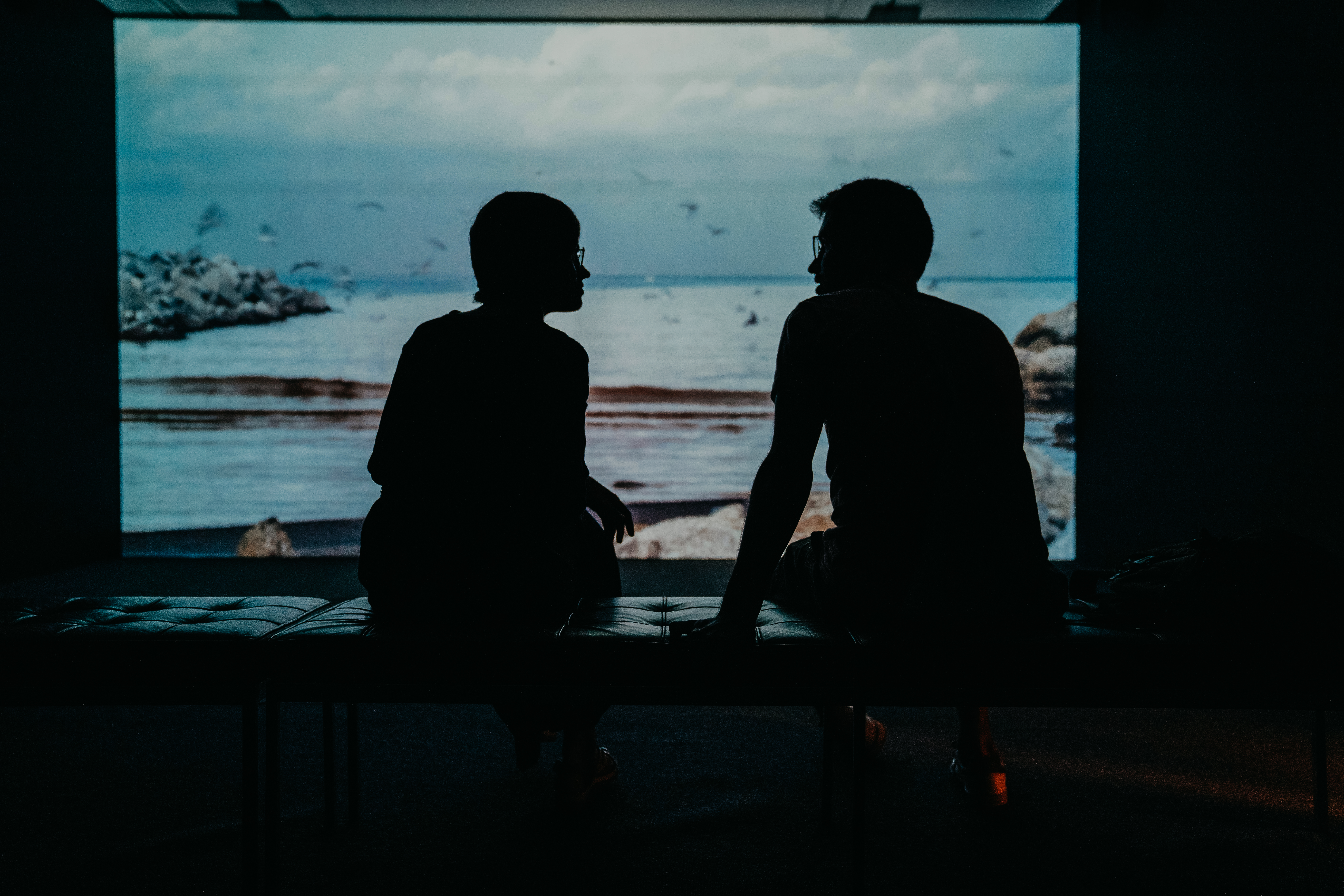 two people talking in shadow