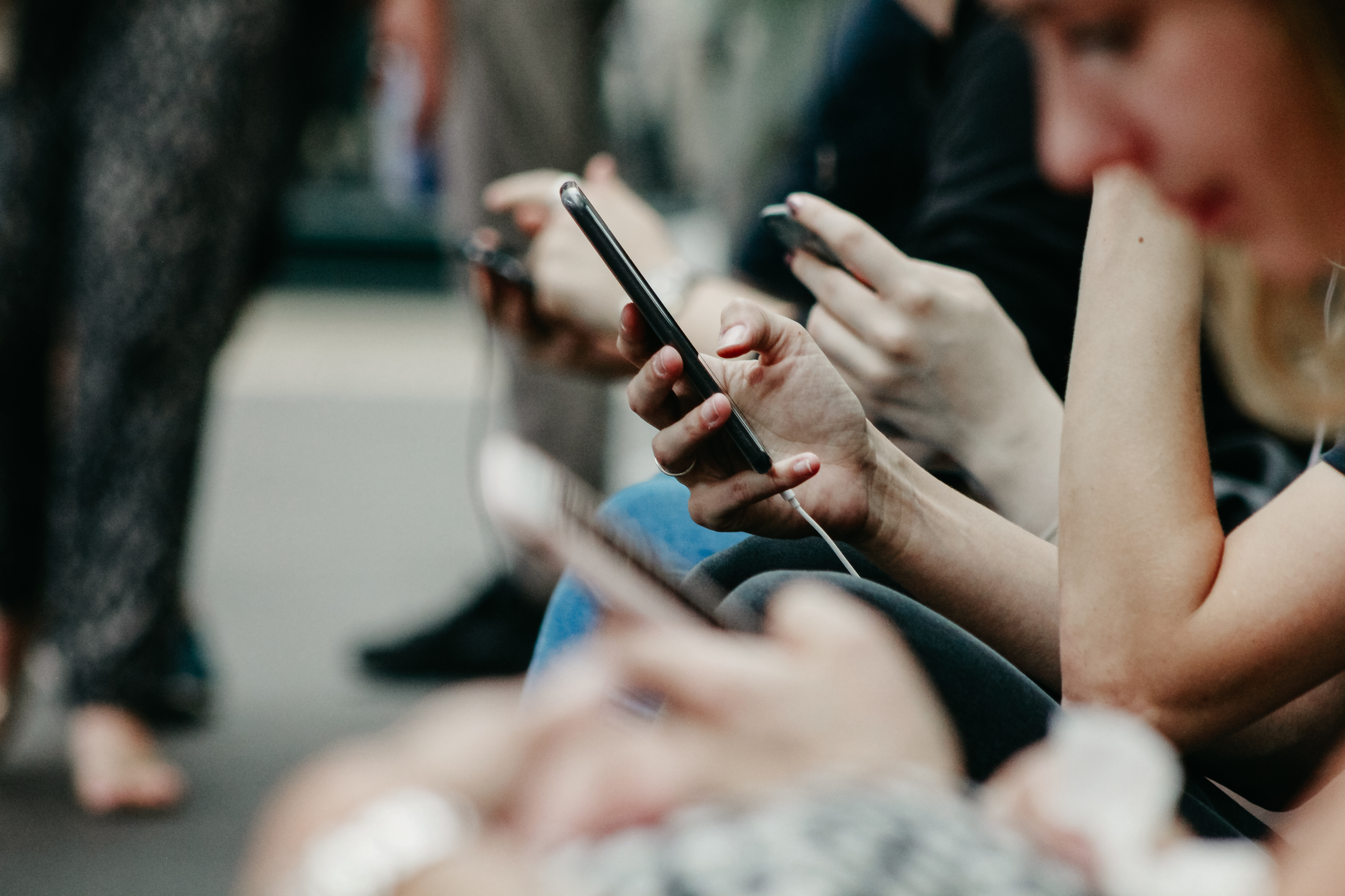people looking at cell phones